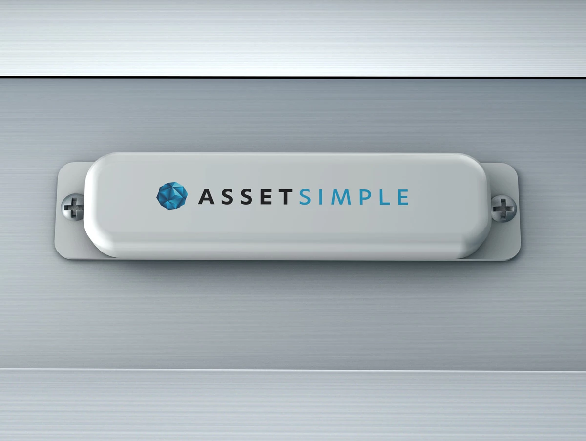 AssetSimple logo on a silver rounded plate mounted with screws on brushed metal panel, blue faceted gem icon