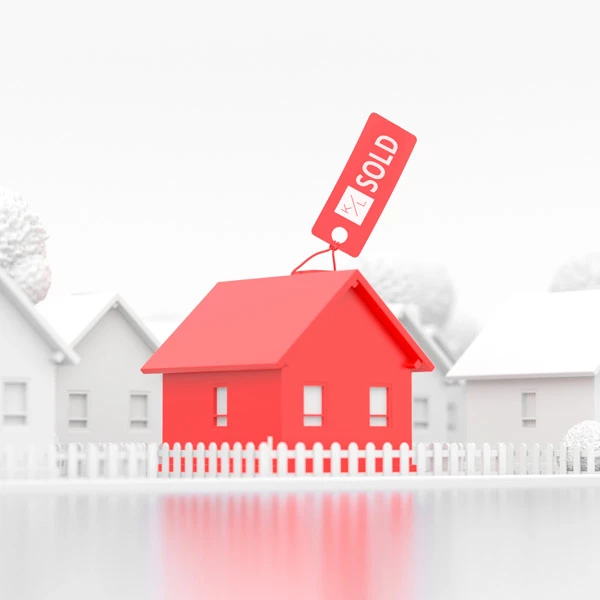 Red 3D house with a red SOLD price tag hanging from the roof on a white fence line