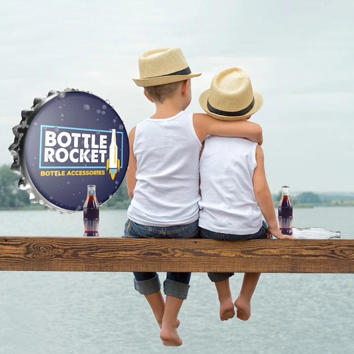 Two kids in straw hats sitting on a wooden dock by a lake, bottle-cap graphic with "BOTTLE ROCKET" headline and "BOTTLE